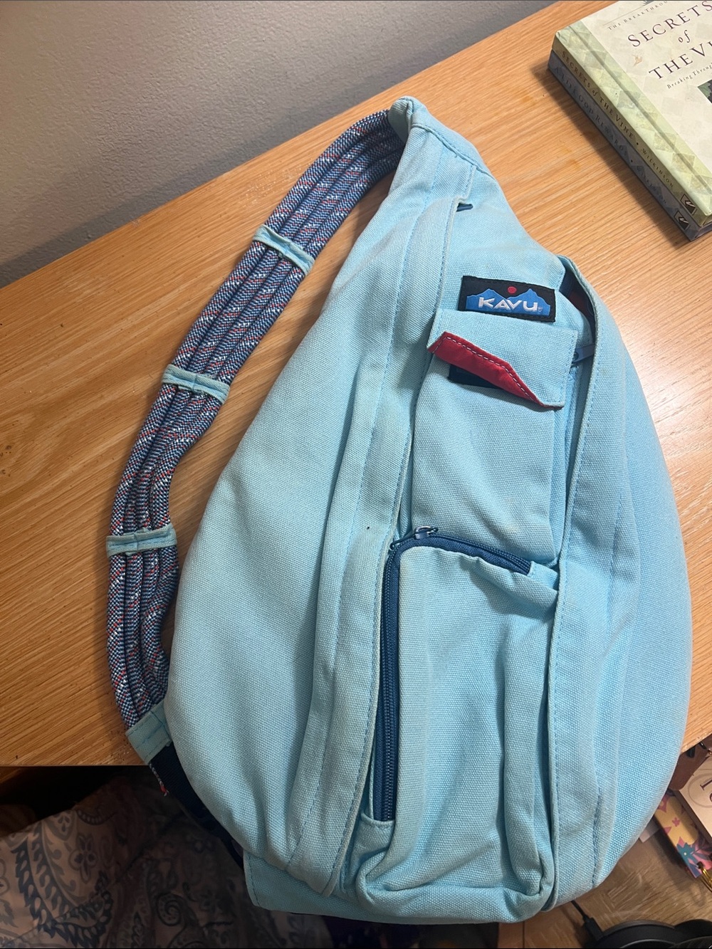 Kavu Light Blue Rope Sling Bag with Red Accent